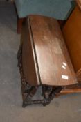 An oval drop leaf table