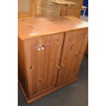 A pine two door cupboard