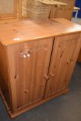 A pine two door cupboard