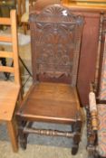 Arts and crafts style carved oak hall chair dated 1913
