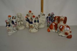 Group of various small Staffordshire spill vases, spaniels, a further Parion ware figure, various