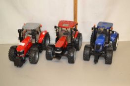 Group of three modern plastic bodied model tractors