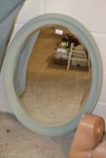 Oval wall mirror in painted frame