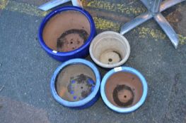 Four blue glazed plant pots