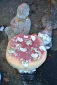 Two garden gnomes and a composition mushroom (3)