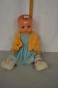 A vintage plastic bodied doll