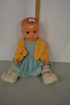 A vintage plastic bodied doll