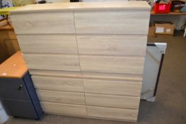 A pair of six drawer chest of drawers