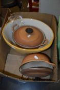 Two Le Creuset casserole dishes and a large mixing bowl