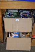 Two boxes of assorted DVD's, games and others