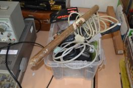 Box of assorted cabling and an oversized cigar
