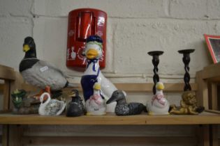 Quantity of assorted duck figurines and a pair of turned wooden candlesticks