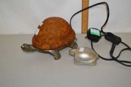 A tortoise shaped table lamp and a further paperweight