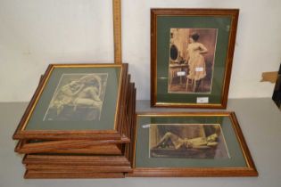 A group of framed reproduction sepia photographs of risque female figures