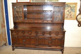 Large 20th Century oak dresser with lead glazed top section
