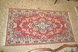 Small modern red floor rug