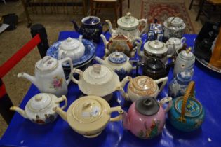 Large collection of various decorated teapots, blue and white bowls and other assorted items