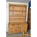 Victorian and later pine dresser with serpentine base, 135cm wide