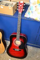 A Red Falcon acoustic guitar
