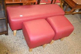 Set of three modern red upholstered stools