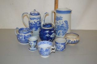 Mixed Lot: Various small blue and white pottery items to include a prunus pattern ginger jar, coffee