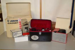 A Canon FTB camera together with leather case and a box of various accessories