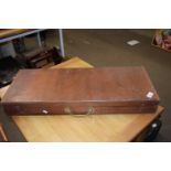 A rectangular wooden box with carry handles