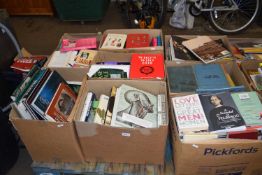 A pallet of eight boxes of assorted books