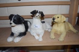 Three resin models of dogs