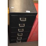 A small six drawer filing cabinet