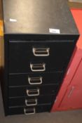 A small six drawer filing cabinet