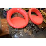 Pair of red upholstered and chrome finish bar stools