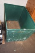 Green plastic and ply wood laundry bin on casters