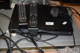 Daewoo DVD player and a Samsung Blue Ray player with remote controls and cabling