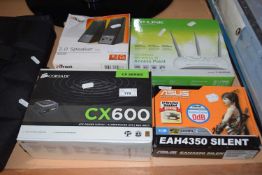 A TP-Link wireless modem, pair of speakers, a Corsair CX600 power supply and an Asos EAH4350
