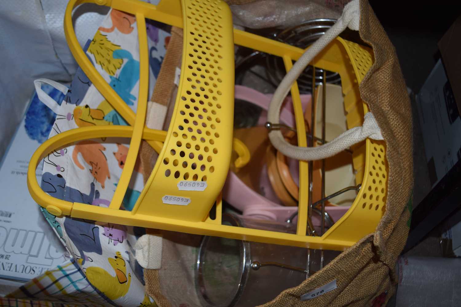 A two tier yellow bathroom caddy together with pink dressing table mirror, storage items etc