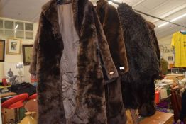 Group of four faux fur coats