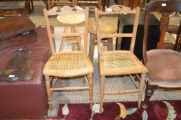 Two cane seated bedroom chairs