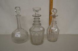 A group of three 19th Century clear glass decanters