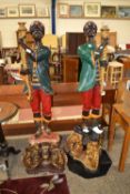 A pair of painted Blackamoor type figures, requiring some renovation, 147cm high