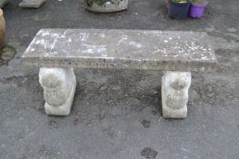 Concrete garden seat with lion formed base supports, 120cm wide