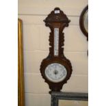 Late 19th Century barometer and thermometer combination in carved frame