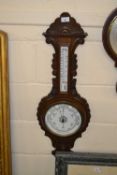 Late 19th Century barometer and thermometer combination in carved frame