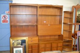 A suite of mid Century teak furniture, probably by Nathan, comprising two bookcase cabinets and a