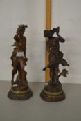 After Ferrand a pair of bronzed metal figures on circular bases
