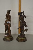 After Ferrand a pair of bronzed metal figures on circular bases