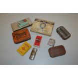 A collection of various vintage tobacco tins, cigarette packets, cigarette lighters etc