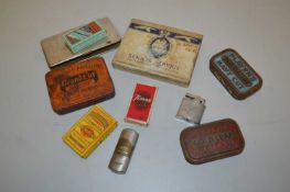 A collection of various vintage tobacco tins, cigarette packets, cigarette lighters etc