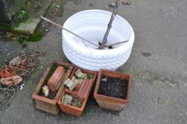 Mixed Lot: Three small terracotta planters together with a further large plastic planter (4)