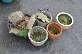A group of five various assorted plant pots, concrete pottery mask, concrete star and other items